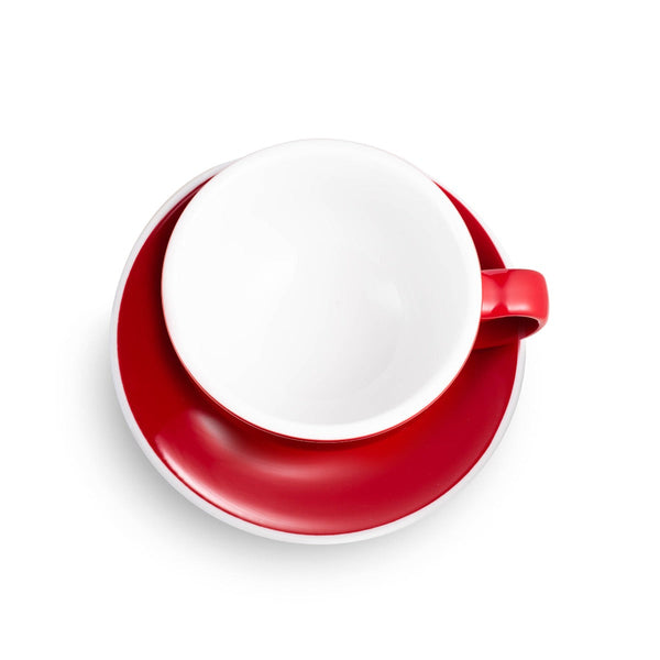 red egg shaped cappuccino cup and saucer