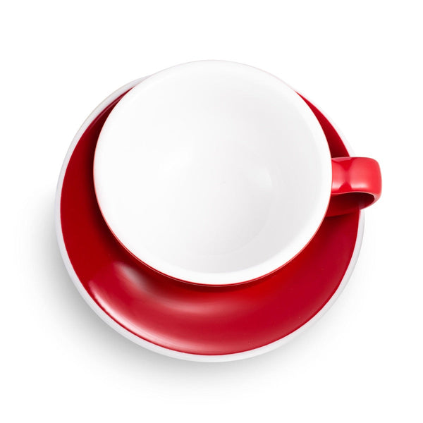 red egg shaped latte cup and saucer