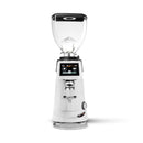 A white and black electric coffee grinder with a clear hopper, shown on a clean white background.