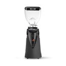 A professional coffee grinder with a matte black base, a clear hopper, and a black top lid, shown on a solid white background.