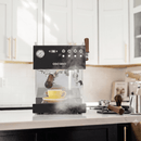 Espresso machine in a kitchen with a cup of coffee being prepared.
