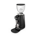 Black coffee grinder on a white background