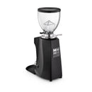 Black coffee grinder with clear glass container on a white background