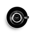 black egg shaped cappuccino cup and saucer