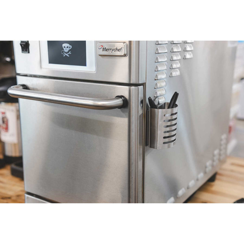 magnetic pen holder on an oven
