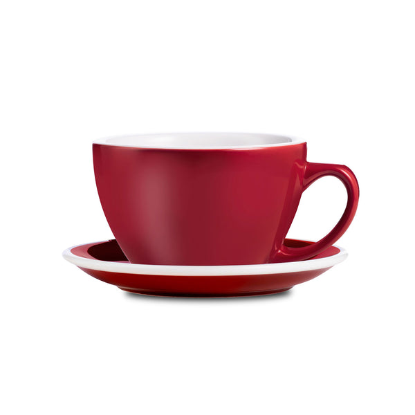 red egg shaped cappuccino cup and saucer