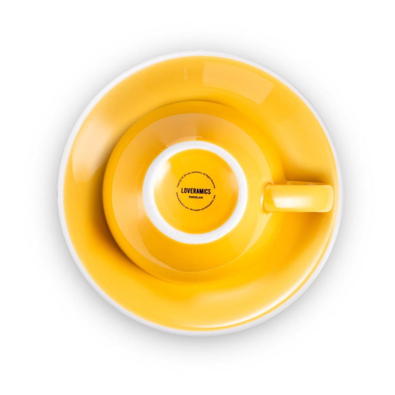 yellow egg shaped latte cup and saucer